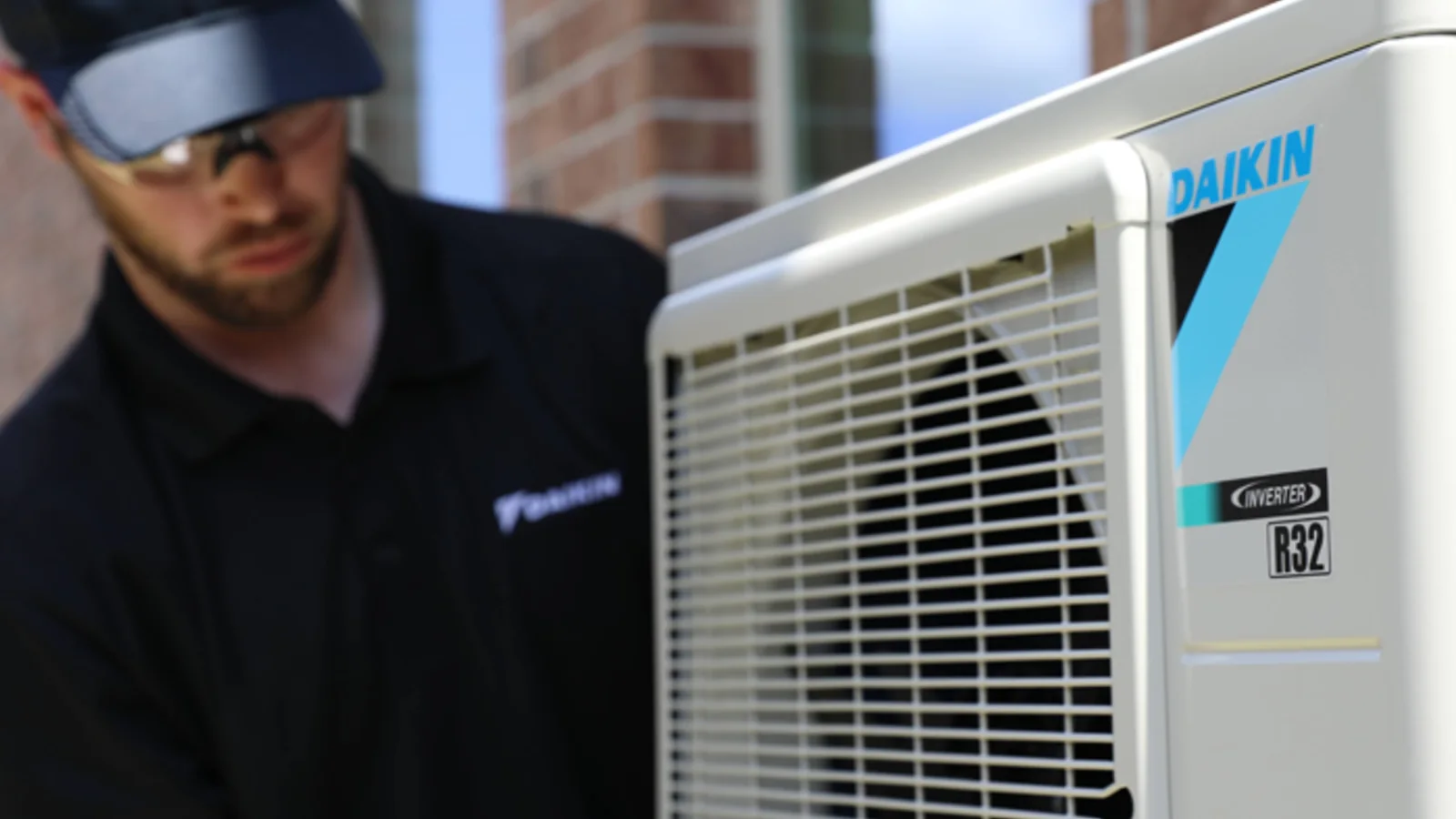 Daikin technician working on an outdoor mini-split condenser