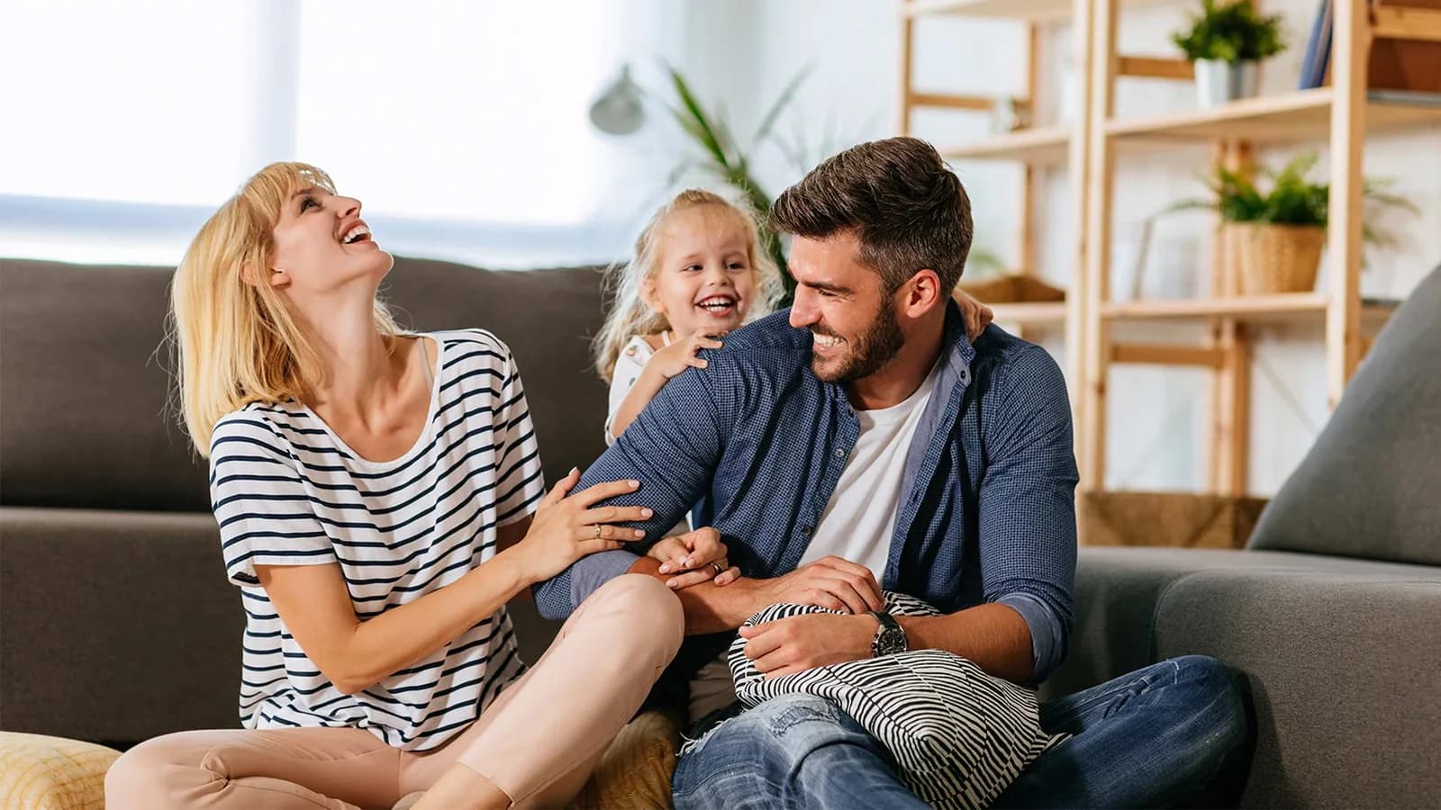 Family enjoying a comfortable living room on Fujitsu General America’s residential page
