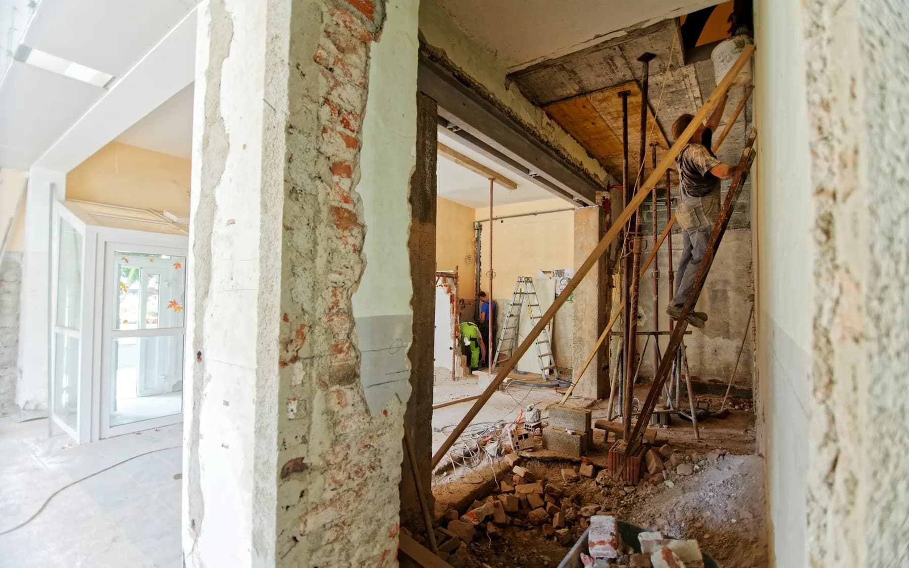 Interior of a home being opened and renovated around existing building systems